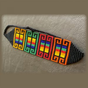 Colorful Beaded Bracelet With Patterns Of Orange, Red, Green, And Yellow